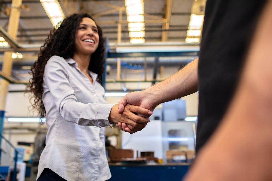 factory-supervisor-shaking-hands-with-worker_774935-2996