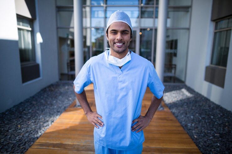 portrait-male-surgeon-standing-with-hands-hip_107420-69285
