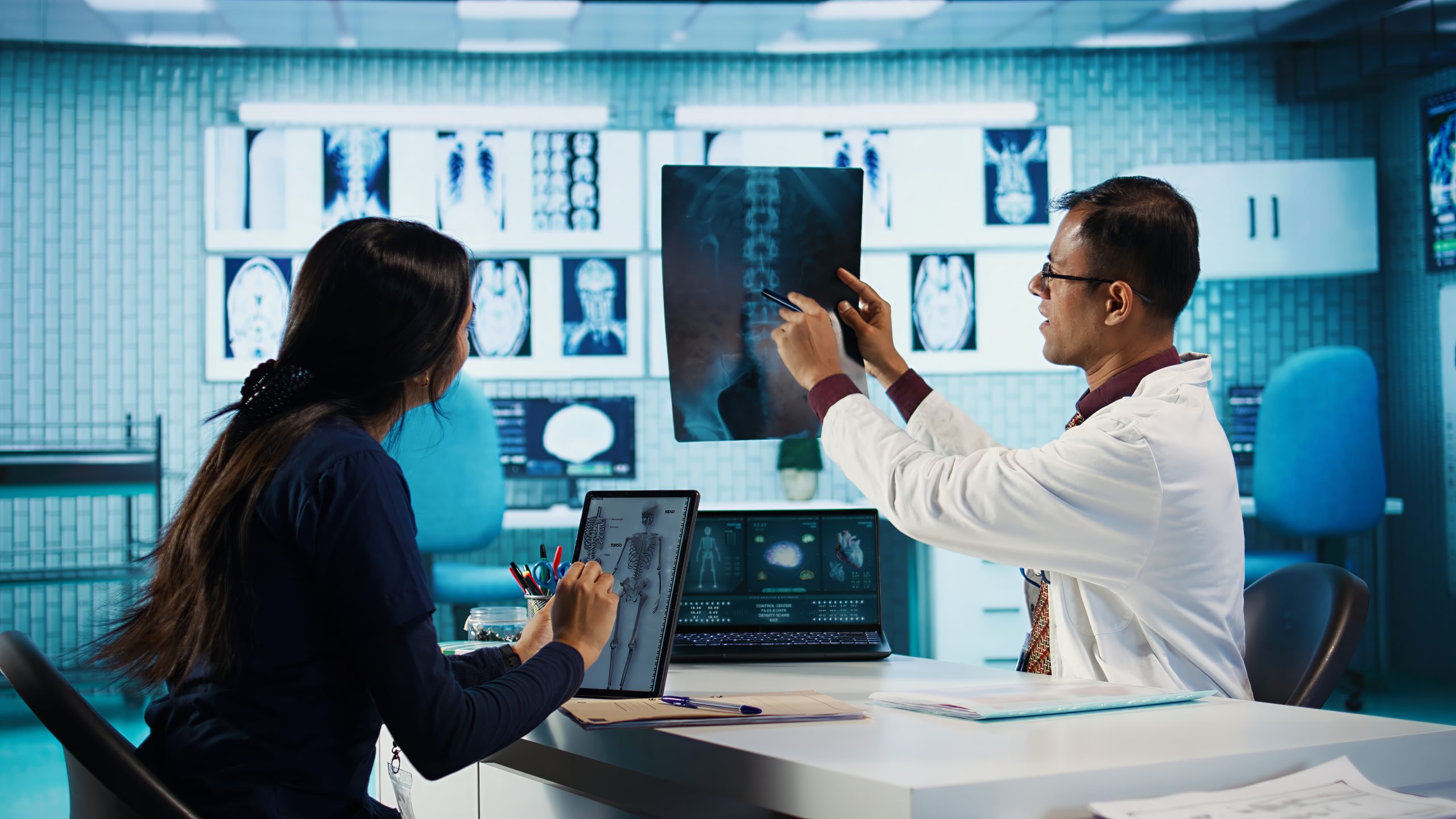 Professional doctor and patient in a medical check up for scan interpretation